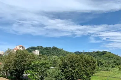a view of a hill with trees and buildings at Costa Linda 1-19, walking distance from the beach in Jacó