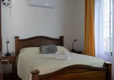 a bedroom with a bed with a towel on it at Casa Kamagu in Fortuna