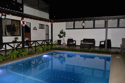 a large swimming pool in the middle of a building at Casa Kamagu in Fortuna