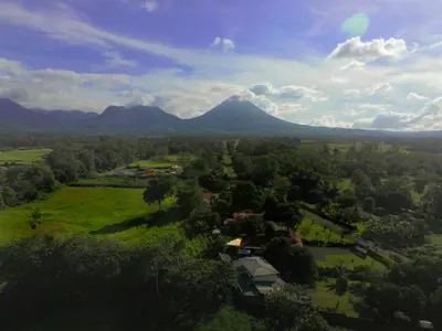 an aerial view of a farm with a mountain in the background at Casa Kamagu in Fortuna