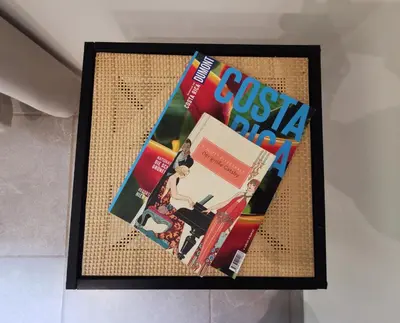 a picture of some magazines on a table at Riverside Apartments - Walk to the Beach in Santa Teresa! Newly Renovated! in Santa Teresa Beach
