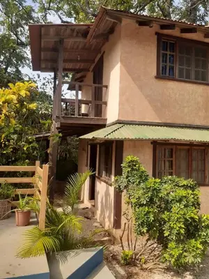 a house with a balcony on top of it at Apartamento Boruca Tamarindo in Tamarindo