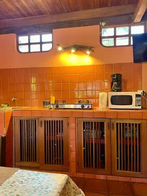 a kitchen with a counter with a microwave on it at Apartamento Boruca Tamarindo in Tamarindo