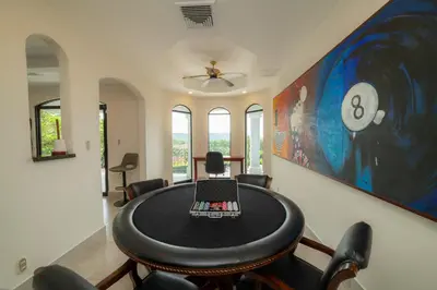 a dining room with a table and chairs at Casa Patron 6 bdrs pool in Los Suenos in Herradura