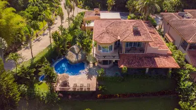 an aerial view of a house with a swimming pool at Casa Oasis 5 bdrs private pool in Los Suenos in Herradura