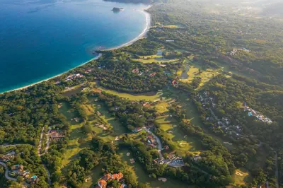 an aerial view of a island with the ocean at Terrace 2BR Condo - Bougainvillea - Reserva Conchal Golf Resort in Playa Conchal