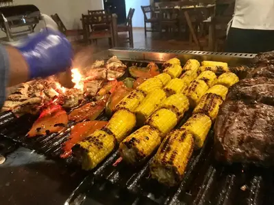 a grill with different types of food on it at Nandel Beach Resort in La Cruz