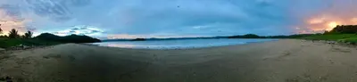 a view of a beach with a cloudy sky at Nandel Beach Resort in La Cruz