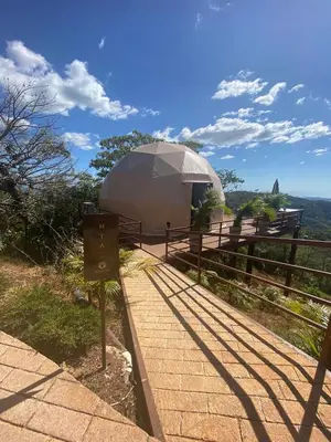 a large dome tent on top of a hill at Kintiri Glamping in Nicoya