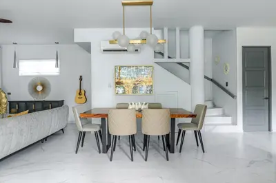 a dining room with a table and chairs at Peace Villa Santa Teresa - Walking distance to the beach in Santa Teresa Beach
