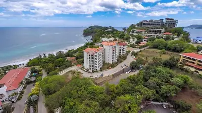 an aerial view of a resort near the beach at Elegant Oceanview Condo with Spacious Open-Concept Floor Plan and Inviting Beach Design in Playa Flamingo