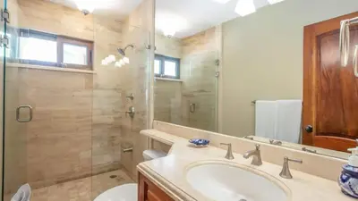 a bathroom with a sink and a shower at Chic Condo with a Stylish Coastal Design in an Exclusive Condo Community with Direct Beach Access in Playa Flamingo