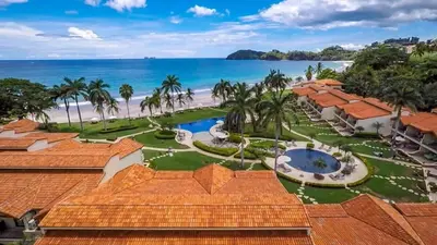an aerial view of the resort and the beach at Chic Condo with a Stylish Coastal Design in an Exclusive Condo Community with Direct Beach Access in Playa Flamingo