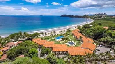 an aerial view of the resort and beach at Chic Condo with a Stylish Coastal Design in an Exclusive Condo Community with Direct Beach Access in Playa Flamingo