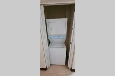 a white washer and dryer in a closet at Jazmin Del Sol steps away from Playa Potrero !! in Potrero