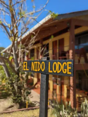 a street sign in front of a house at El Nido Lodge in Monteverde Costa Rica