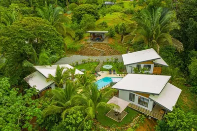 an aerial view of a house with a swimming pool at The Sutton - Boutique Jungle Experience - Walk to Envision Festival in Uvita