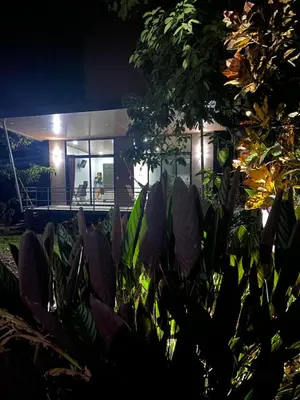 a house with a lot of plants in front of it at Bongalow Villa Sarchi in Sarchí