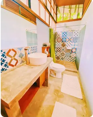 a bathroom with a sink and a toilet at Kinkajoungalows - Amaya Family, Drake Bay, Osa Peninsula in San Pedrillo