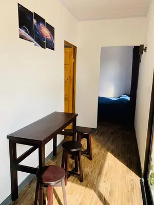 a room with a table and two stools and a bed at Hotel Sirius Costa Rica in San Mateo