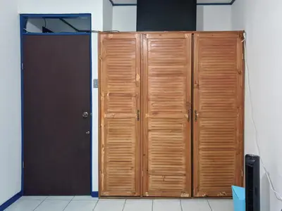 a pair of wooden lockers in a room at Entire Comfy apartment for you, 5 min SJO Airport in Alajuela City