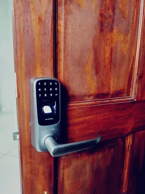 a remote control on a wooden door at Villas del General in San Isidro