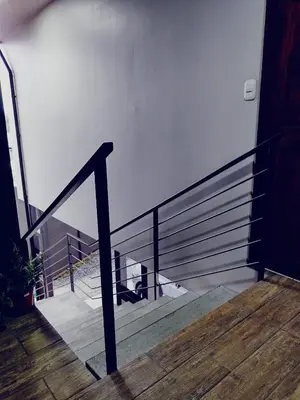 a metal railing on a stairs with a balcony at Villas del General in San Isidro