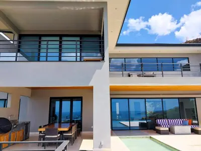 a house with a view of the ocean at Casa de Iluminacion - Gorgeous 5-BR oceanview Villa with private infinity Pool in Brasilito