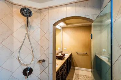 a bathroom with a shower and a sink at LUXURY 3BR appt, CENTER, 2 min to BEACH, hi-speed wifi in Tamarindo