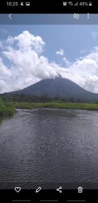 a view of a mountain and a river with water at Apartamento La Fortuna #2 in Fortuna