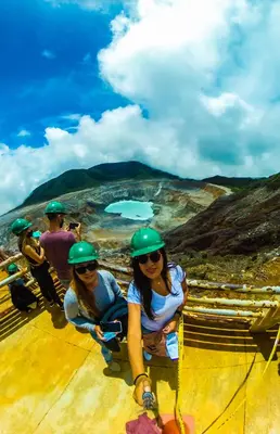 a group of people wearing helmets on top of a roof at Dreamcatcher House Bus Experience 2 in Sarchí