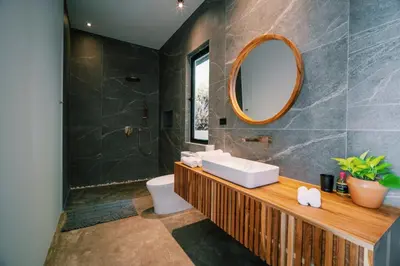 a bathroom with a sink and a mirror at Seataya Villas in Santa Teresa Beach