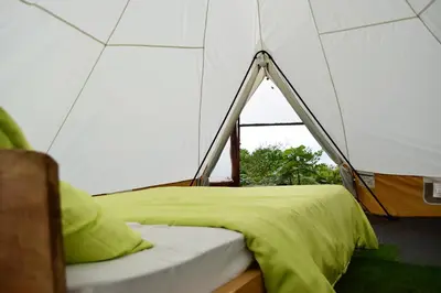 a room with a tent with a bed in it at Escapadita al Bosque in San Isidro