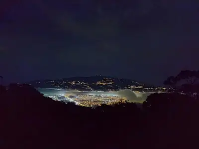 a view of a city at night at Escapadita al Bosque in San Isidro