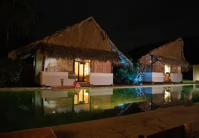 a resort with a swimming pool at night at LA QUEBRADA ECO LODGE Hotel Boutique in Potrero