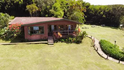a small house in the middle of a yard at Hotel Montaña Monteverde in Monteverde Costa Rica