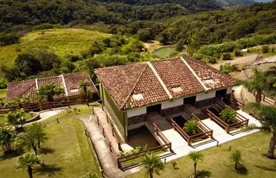 an aerial view of a house with a mountain at Hotel Montaña Monteverde in Monteverde Costa Rica