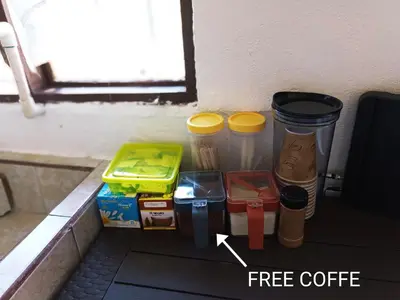 a pile of coffee cups and trash cans next to a window at Departamentos Patricia in Alajuela City