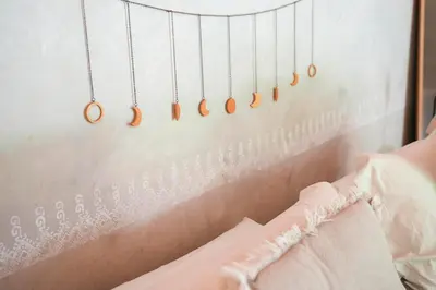 a row of wooden earrings hanging on a wall at Norte Nosara - Steps to Playa Guiones in Nosara