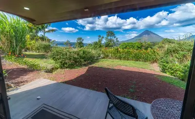 a porch with a view of a mountain at Villas Paradise Arenal Volcano Lake View in El Castillo de La Fortuna
