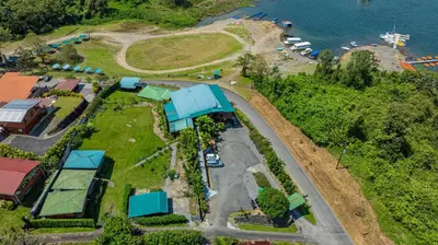 an aerial view of a park next to the water at Villas Paradise Arenal Volcano Lake View in El Castillo de La Fortuna
