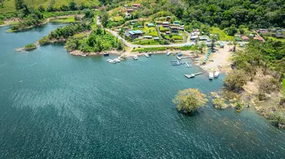 an aerial view of a lake with a resort at Villas Paradise Arenal Volcano Lake View in El Castillo de La Fortuna