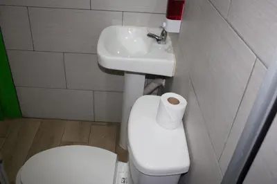a bathroom with a toilet and a sink at Hotel La Castella in San José