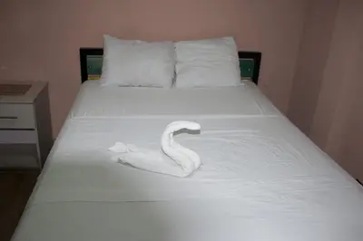 a swan made out of towels on a bed at Hotel La Castella in San José