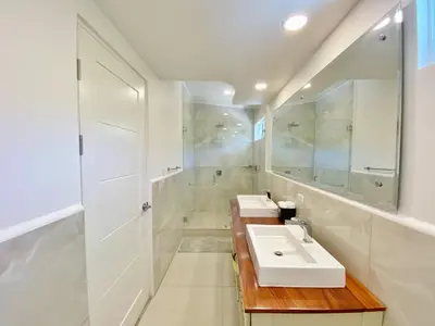 a bathroom with two sinks and a shower at Nicoya Villas in Mal País