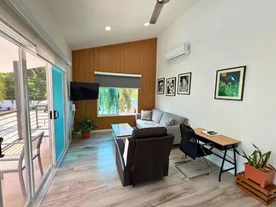 a living room with a couch and a table at Nicoya Villas in Mal País