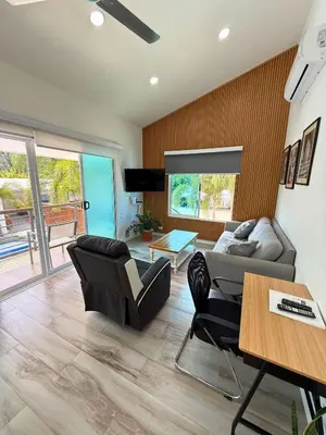 a living room with a couch and a table at Nicoya Villas in Mal País