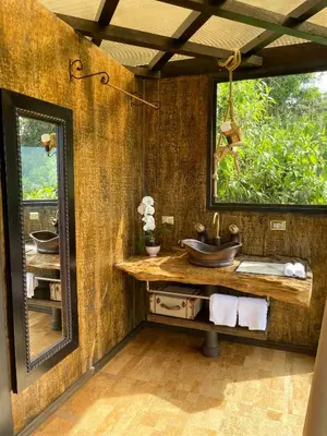 a bathroom with a sink and a mirror at Casa maar -Treetop tent in Río Cuarto