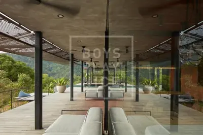 a living room with couches on a wooden deck at Art Villas Costa Rica, Villas & Glamping in Uvita