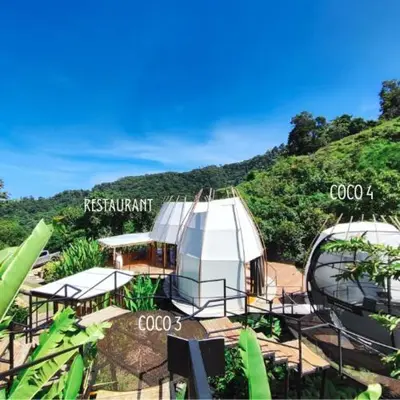 a resort with a white tent on a hill at Art Villas Costa Rica, Villas & Glamping in Uvita